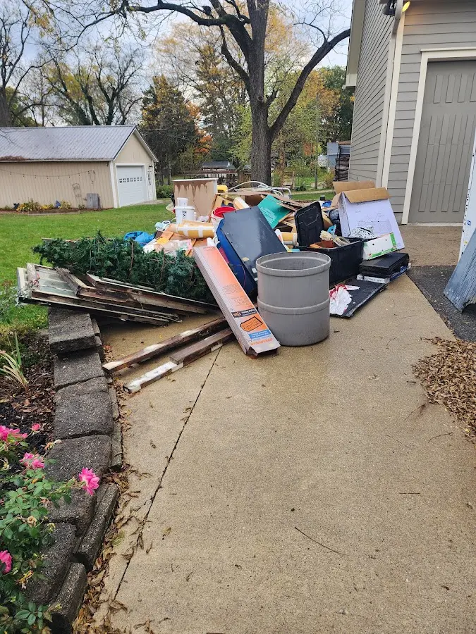 Dumpster being loaded with debris for Demolition Dumpster Rental in North Decatur